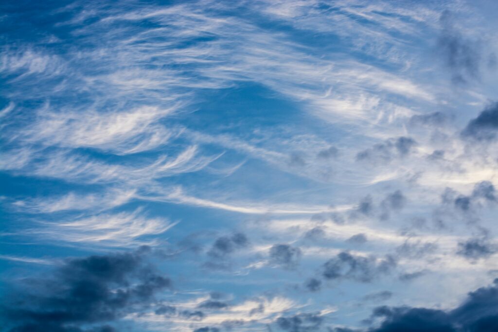Beautiful formation of cirrus clouds against a vibrant blue sky, capturing nature's ever-changing beauty.